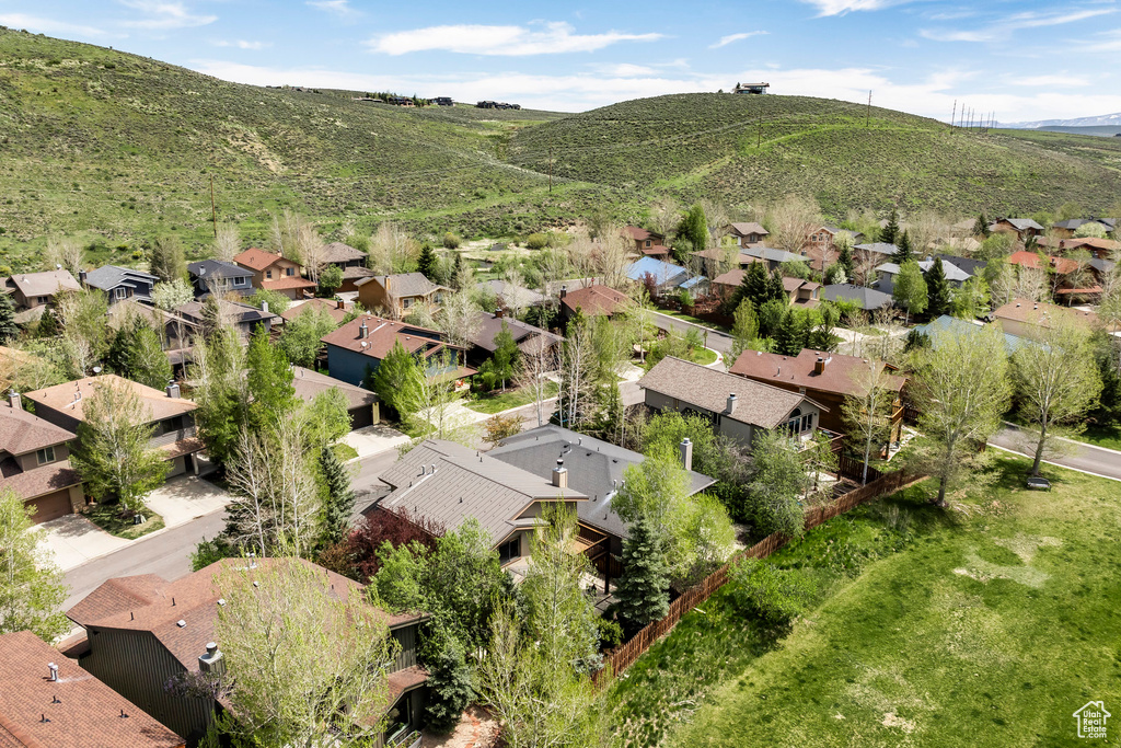 Aerial perspective of suburban area featuring a mountain backdrop