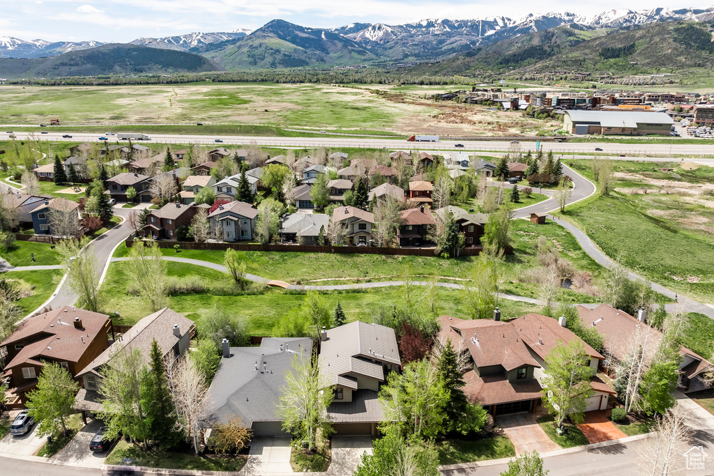 Aerial view of residential area featuring a mountain backdrop
