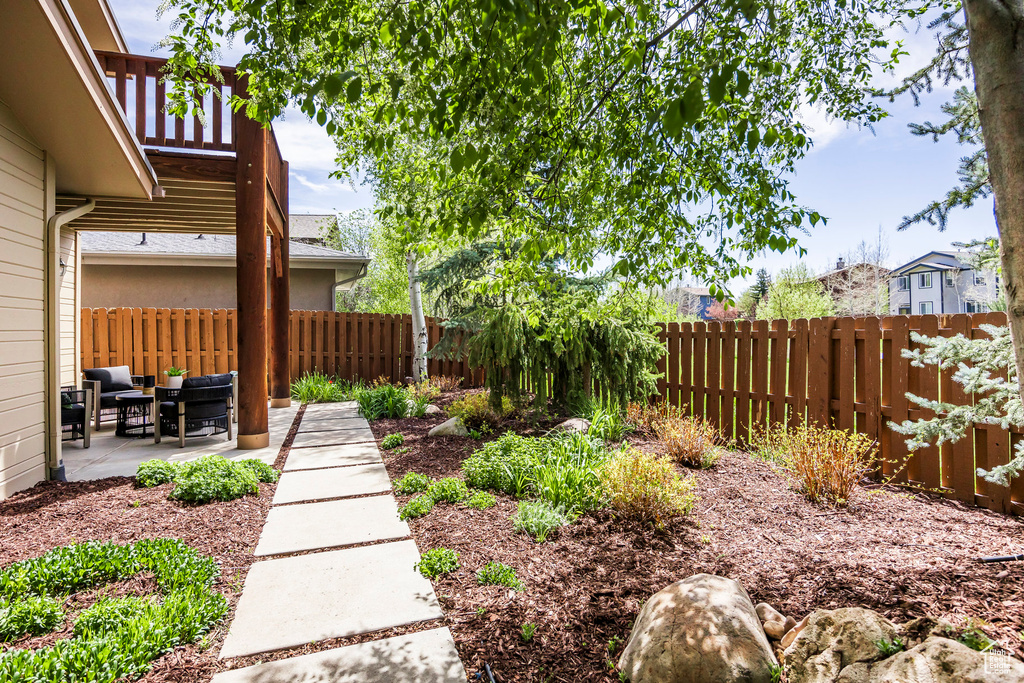 Fenced backyard featuring a patio