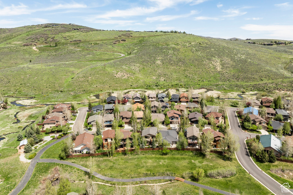 Aerial view of residential area featuring a mountain backdrop