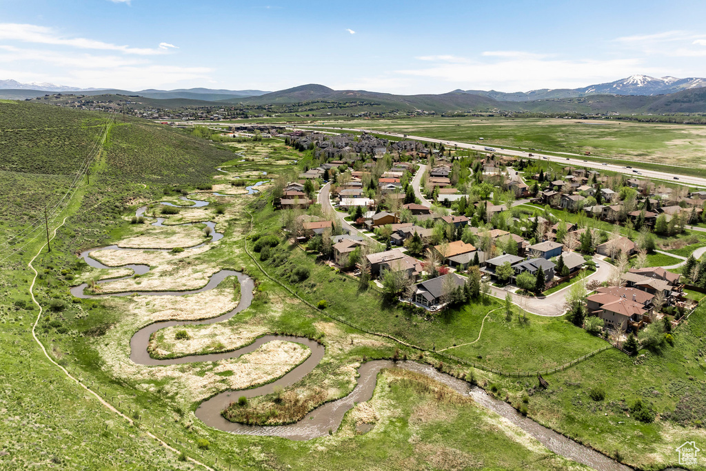 Aerial view of residential area featuring mountains