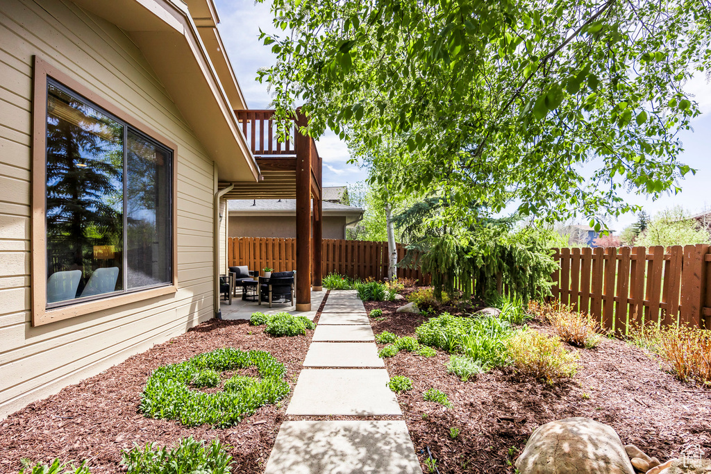 Fenced backyard featuring a patio