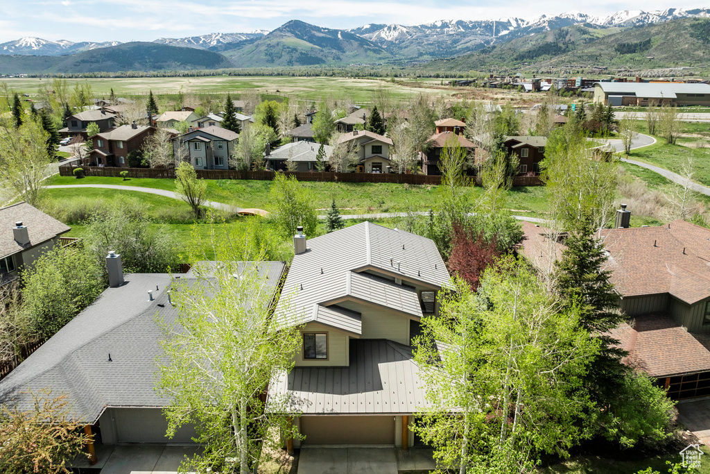 Aerial view of residential area with a mountainous background