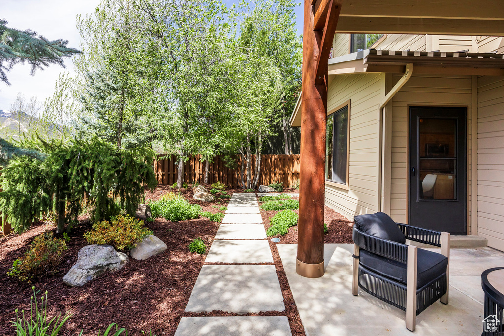View of patio featuring fence