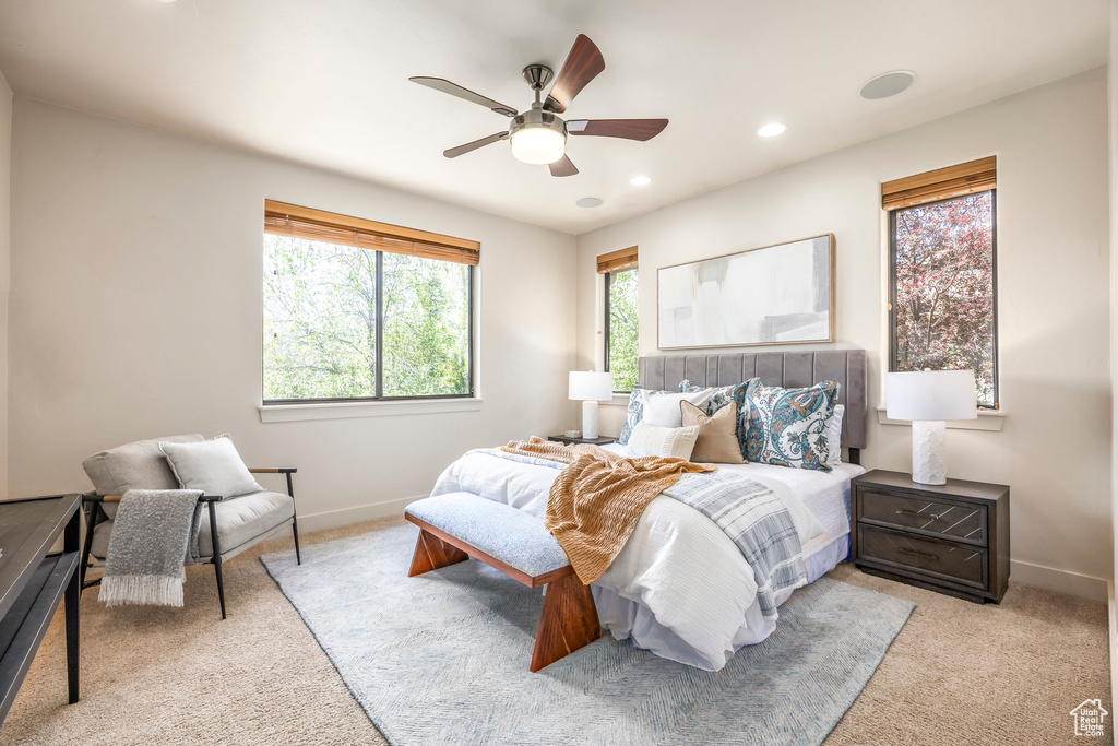 Carpeted bedroom featuring recessed lighting, baseboards, and a ceiling fan