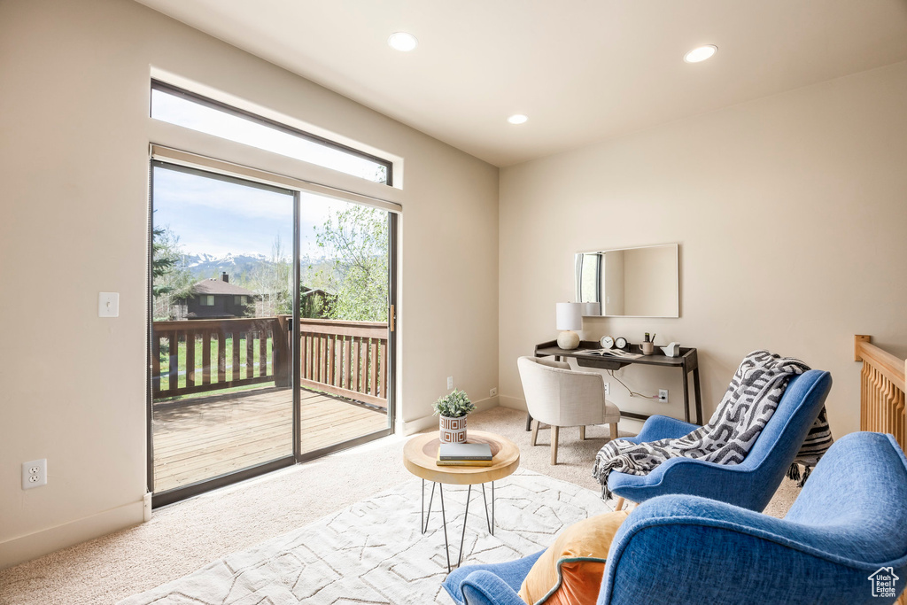 Sitting room featuring carpet flooring, recessed lighting, and baseboards