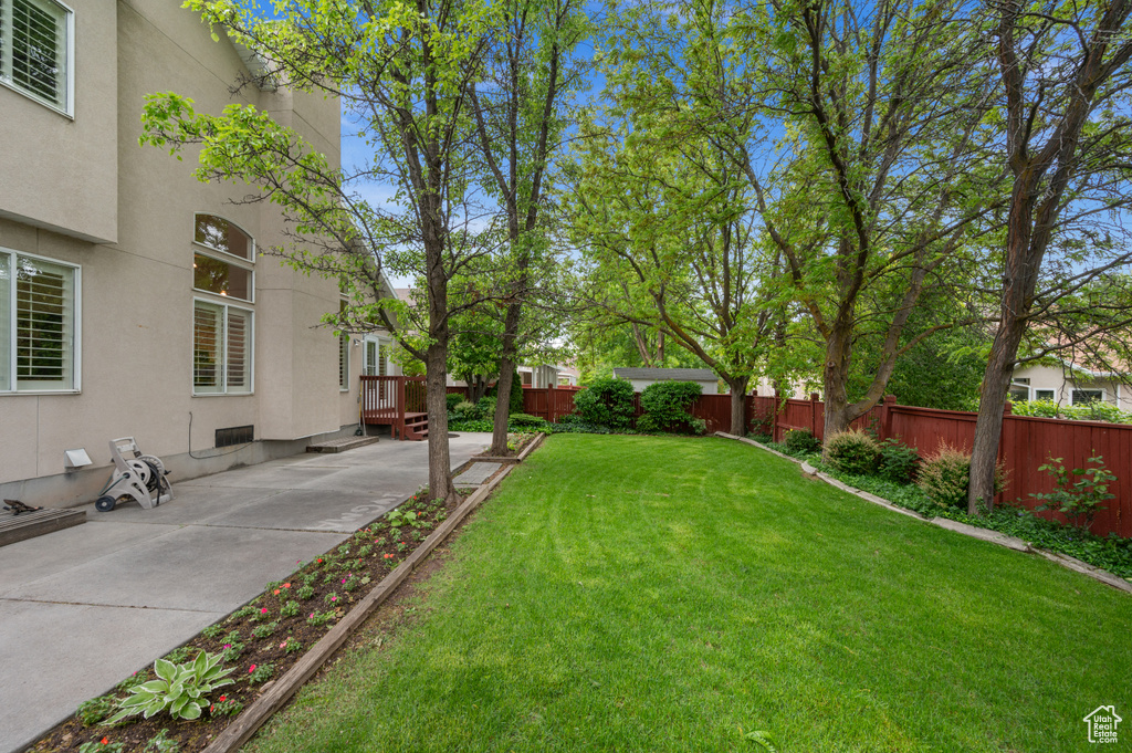 View of yard with a patio