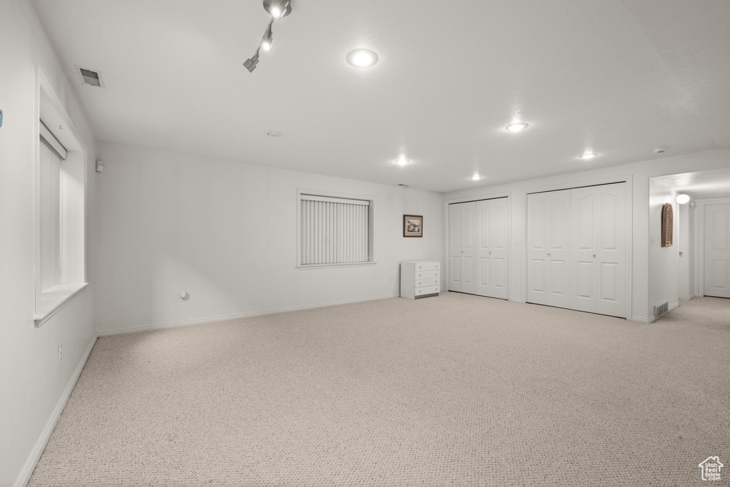Basement featuring carpet, baseboards, and recessed lighting