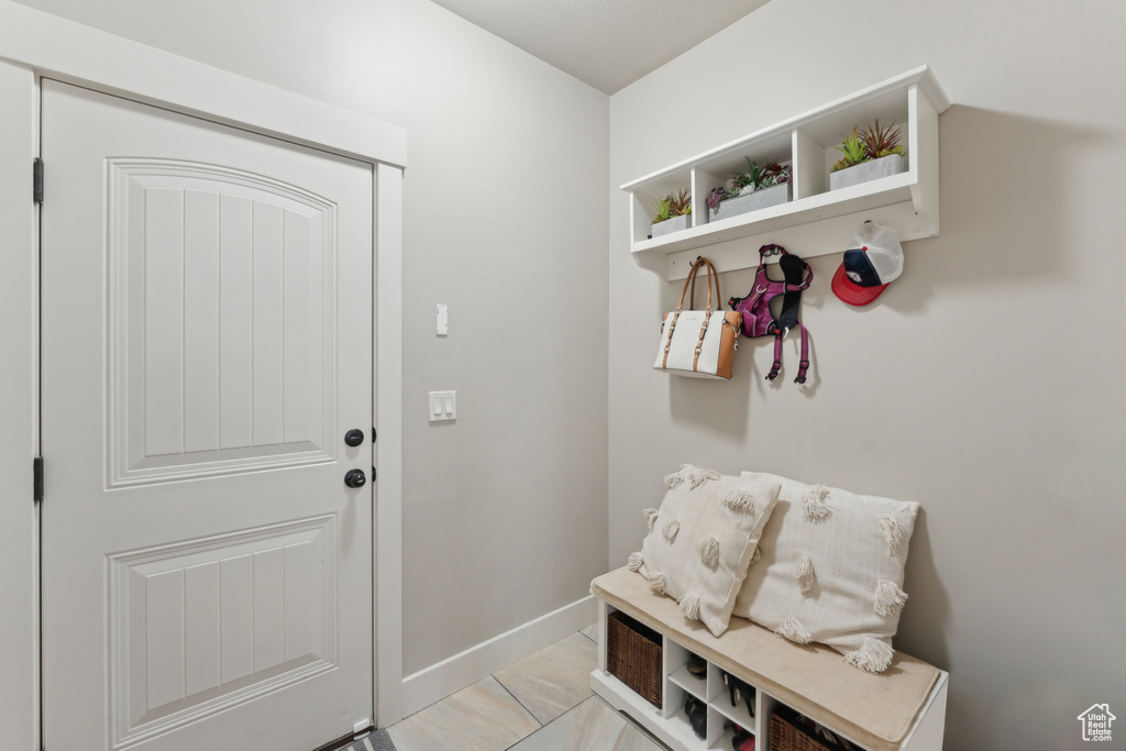 Mudroom featuring baseboards