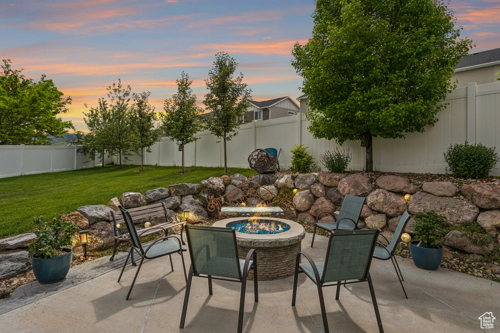 View of patio / terrace with an outdoor fire pit