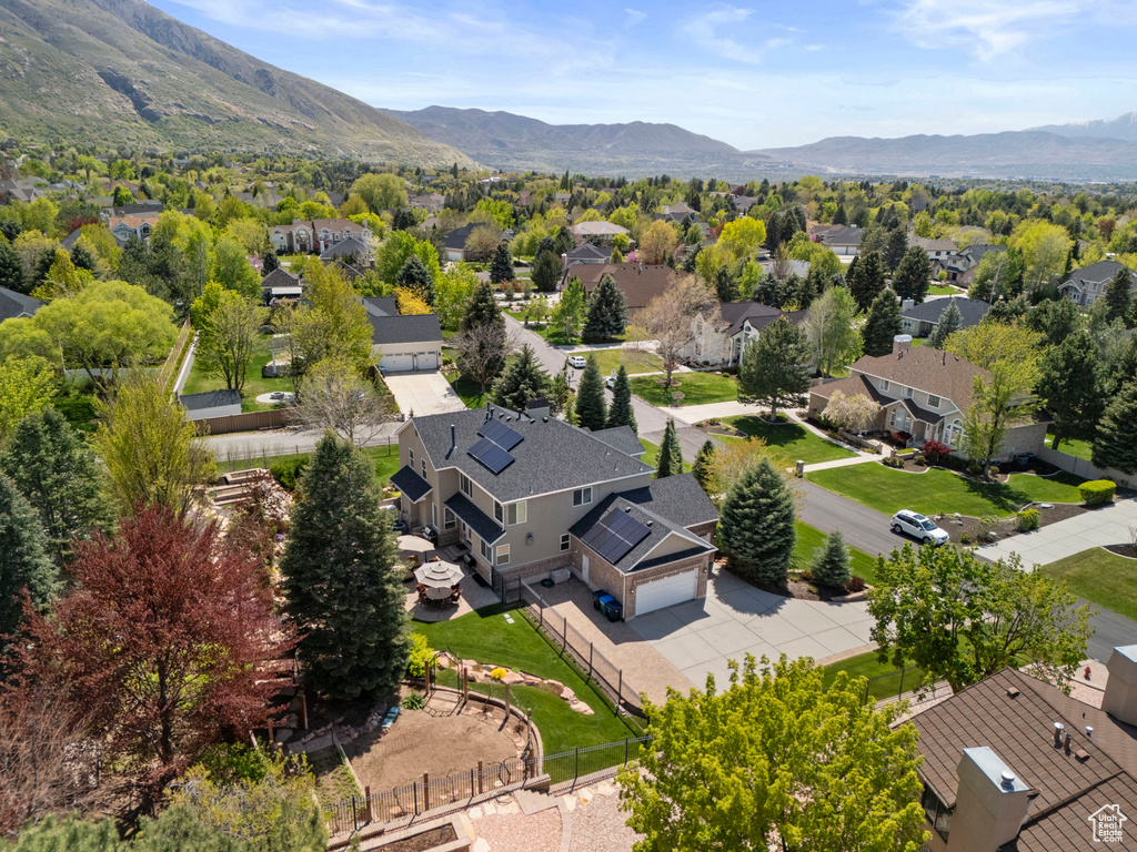 Birds eye view of property with a mountain view and a residential view