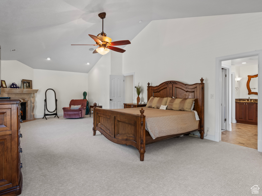 Bedroom featuring light colored carpet, baseboards, high vaulted ceiling, and recessed lighting