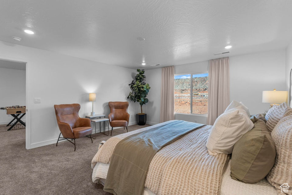 Bedroom featuring recessed lighting, carpet, and baseboards