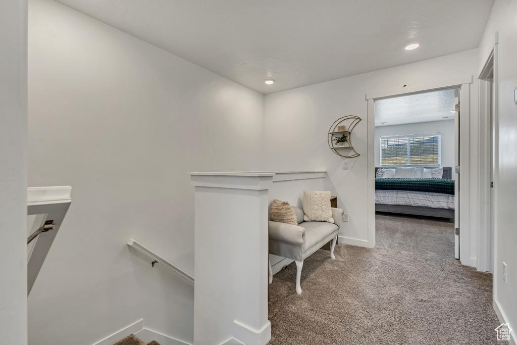 Corridor with an upstairs landing, carpet, recessed lighting, and baseboards