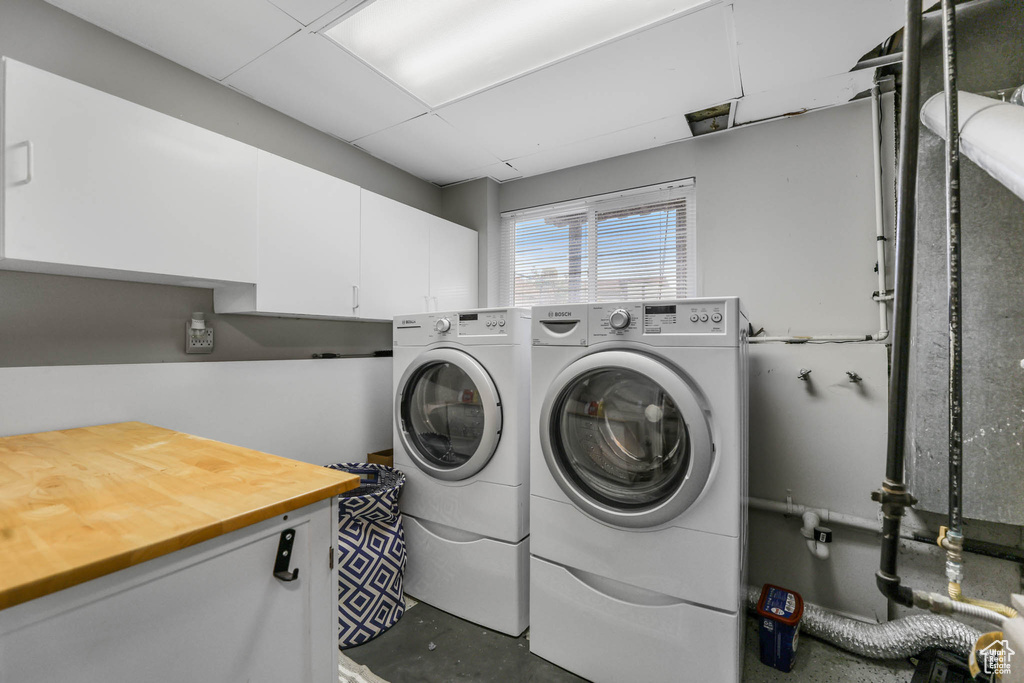 Laundry room with cabinet space and washer and dryer
