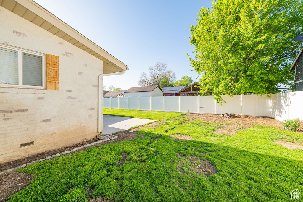 View of yard with a patio