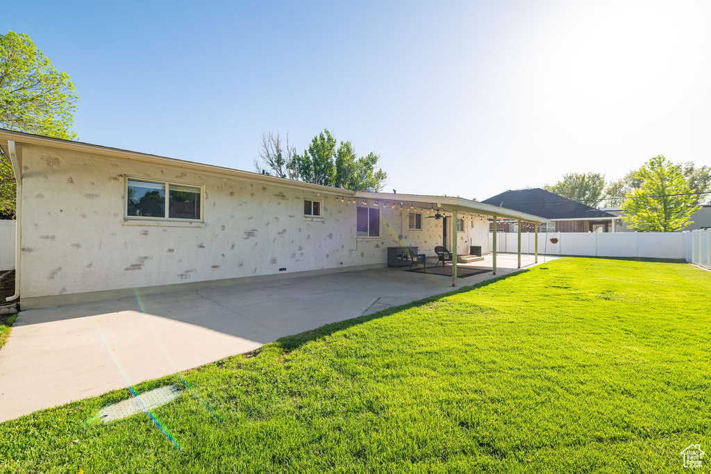 Back of property featuring a patio area