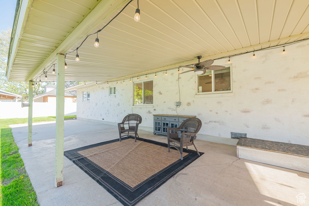 View of patio / terrace featuring ceiling fan and fence