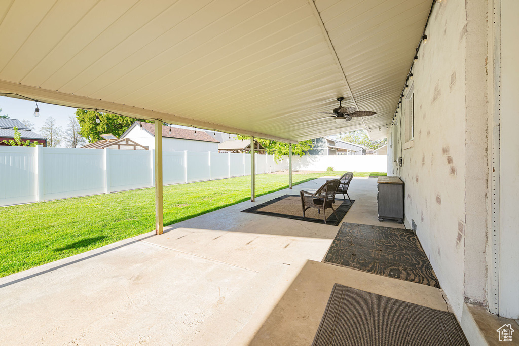 View of patio featuring a ceiling fan