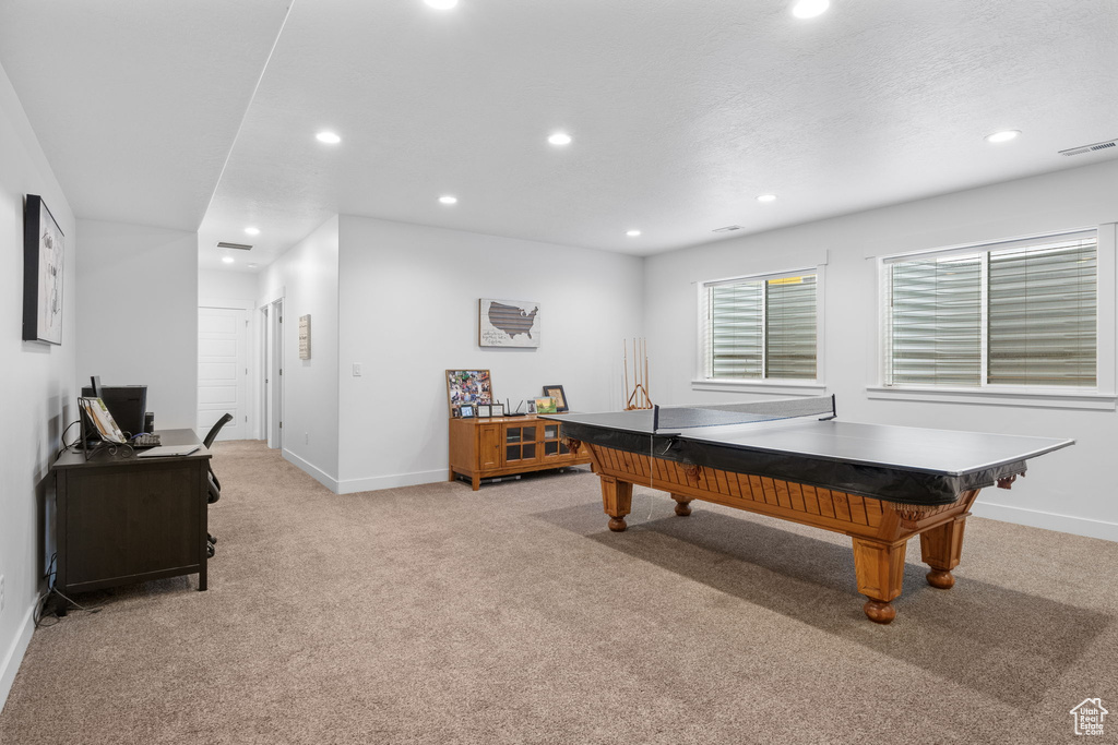 Playroom with light colored carpet, recessed lighting, baseboards, and a desk