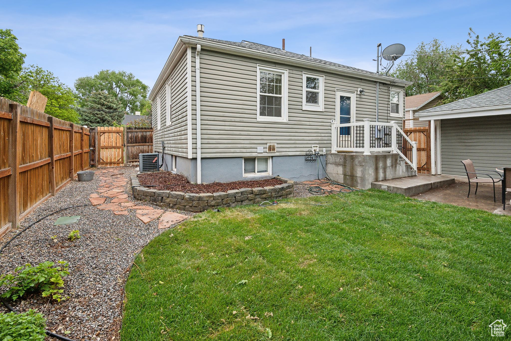 Back of property featuring a patio area and central air condition unit