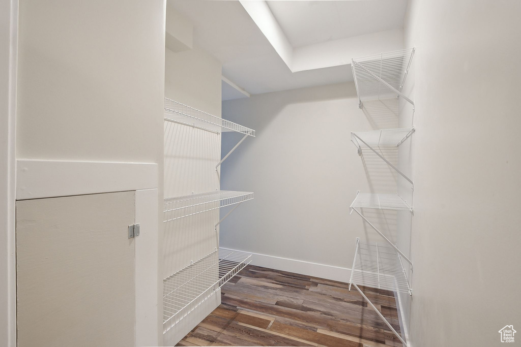 Walk in closet featuring wood finished floors