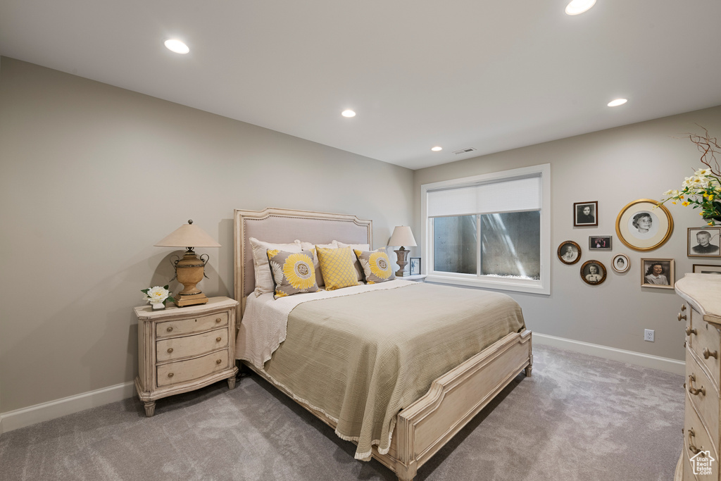Carpeted bedroom featuring recessed lighting and baseboards
