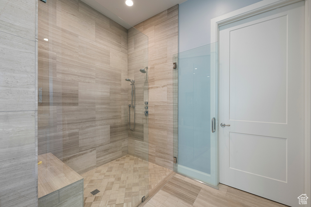 Bathroom featuring a stall shower and recessed lighting