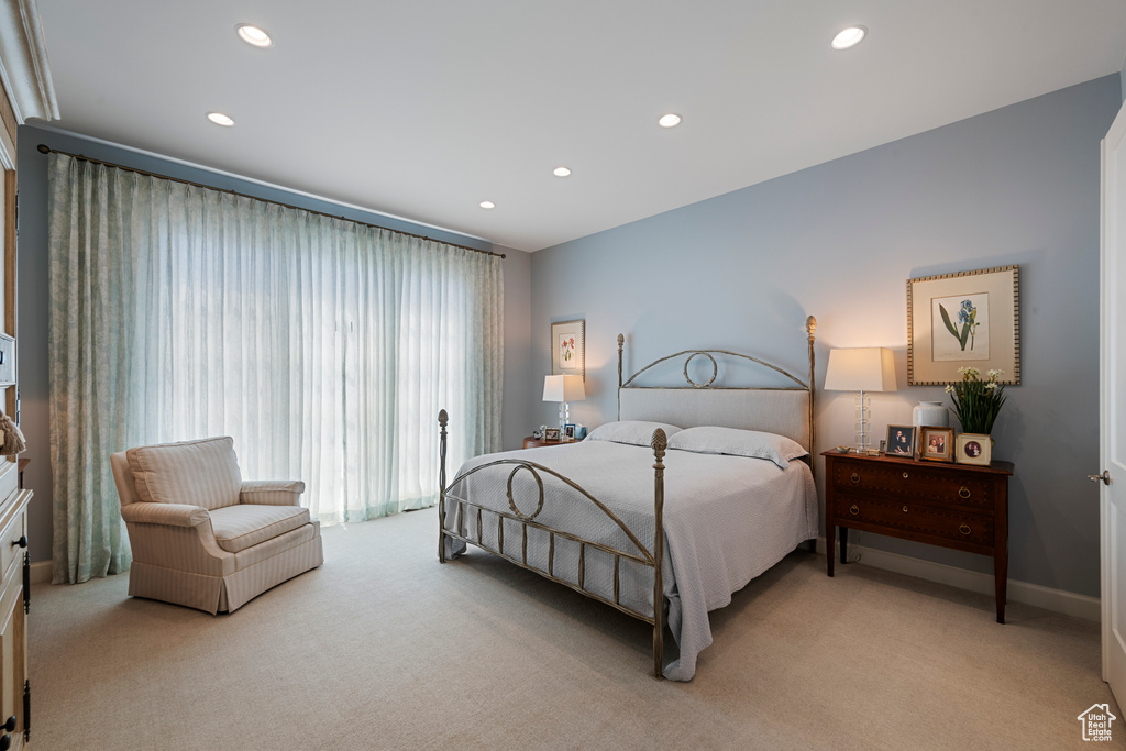 Bedroom featuring light carpet, recessed lighting, and baseboards