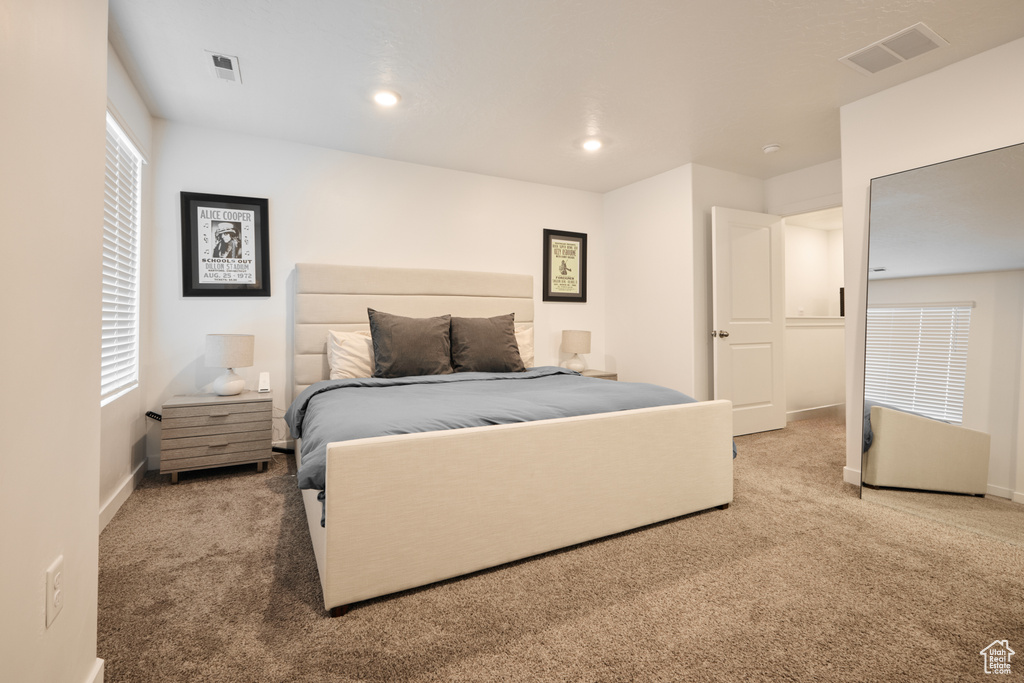 Bedroom featuring carpet floors, baseboards, and recessed lighting