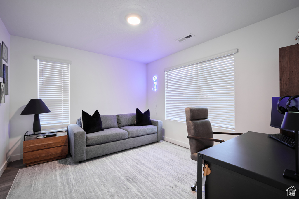 Office area with baseboards and wood finished floors
