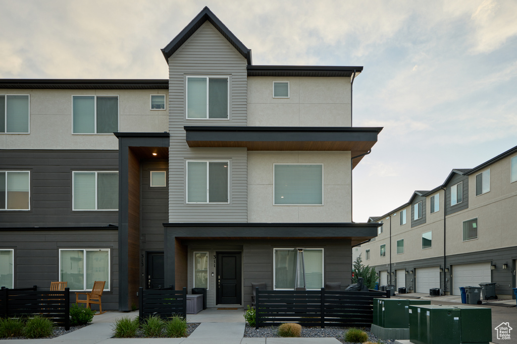 View of property with stucco siding
