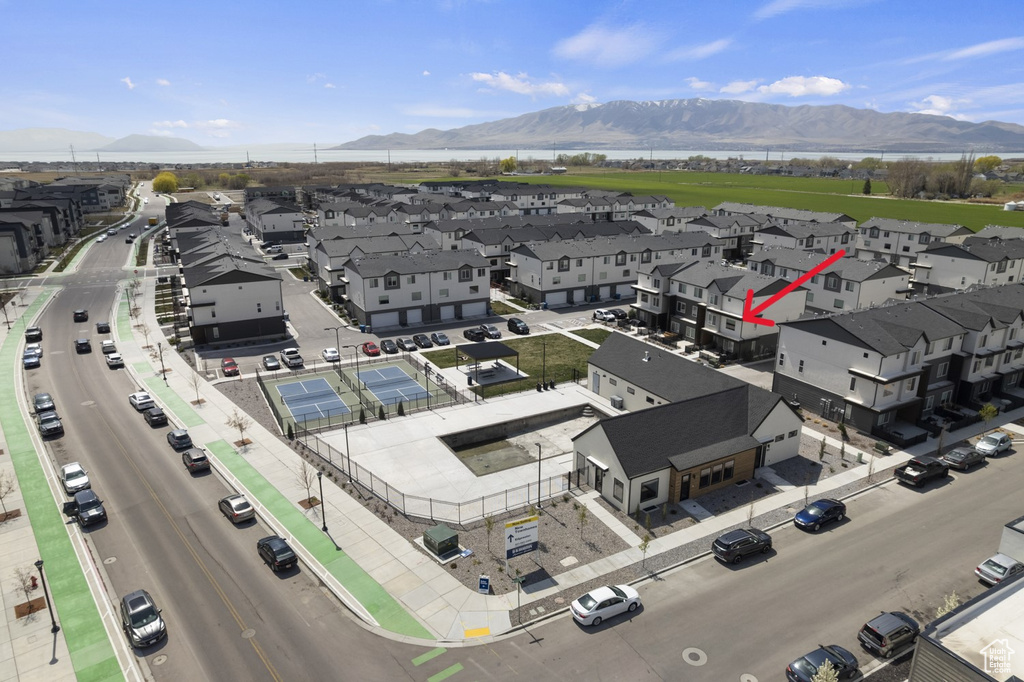 Aerial perspective of suburban area featuring a mountainous background