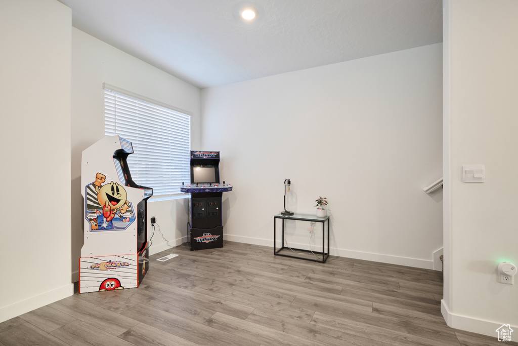 Interior space with wood finished floors and baseboards