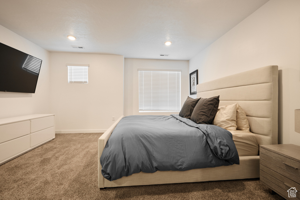 Carpeted bedroom featuring recessed lighting and baseboards
