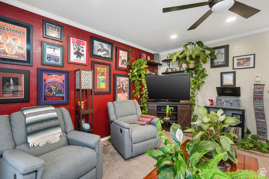 Living room featuring a ceiling fan, ornamental molding, baseboards, and recessed lighting