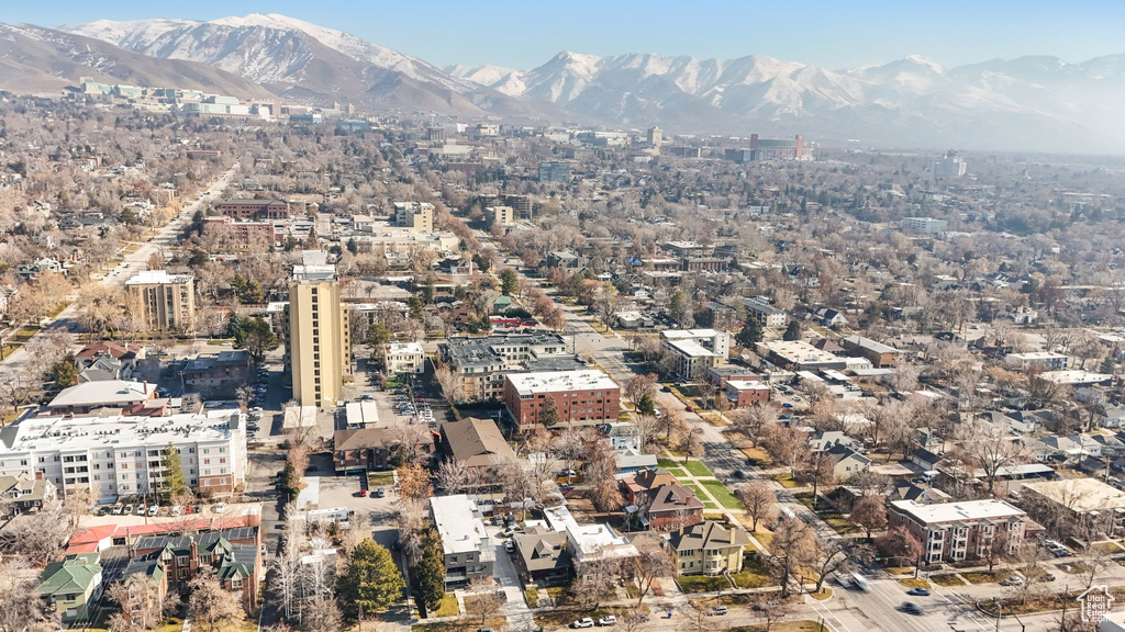 Aerial view of property's location featuring a mountain backdrop