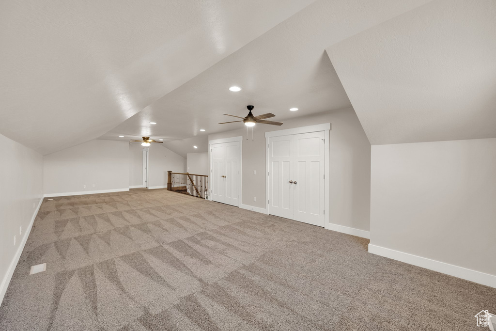 Bonus room featuring vaulted ceiling, recessed lighting, carpet floors, ceiling fan, and baseboards