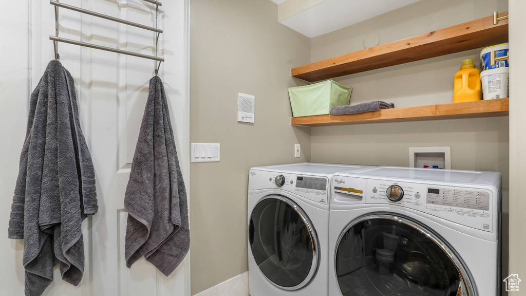 Laundry area featuring independent washer and dryer
