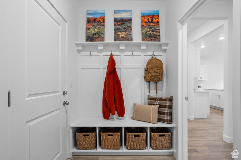 Mudroom featuring light wood-style flooring