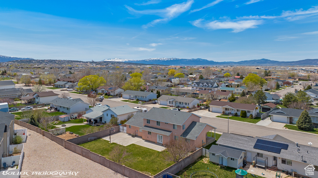Aerial view of residential area featuring mountains