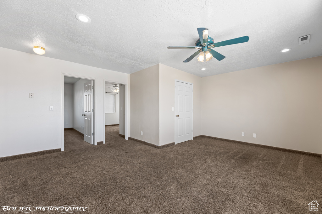 Unfurnished bedroom with carpet flooring, baseboards, a textured ceiling, recessed lighting, and ceiling fan