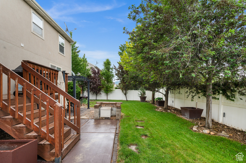 View of yard with a patio