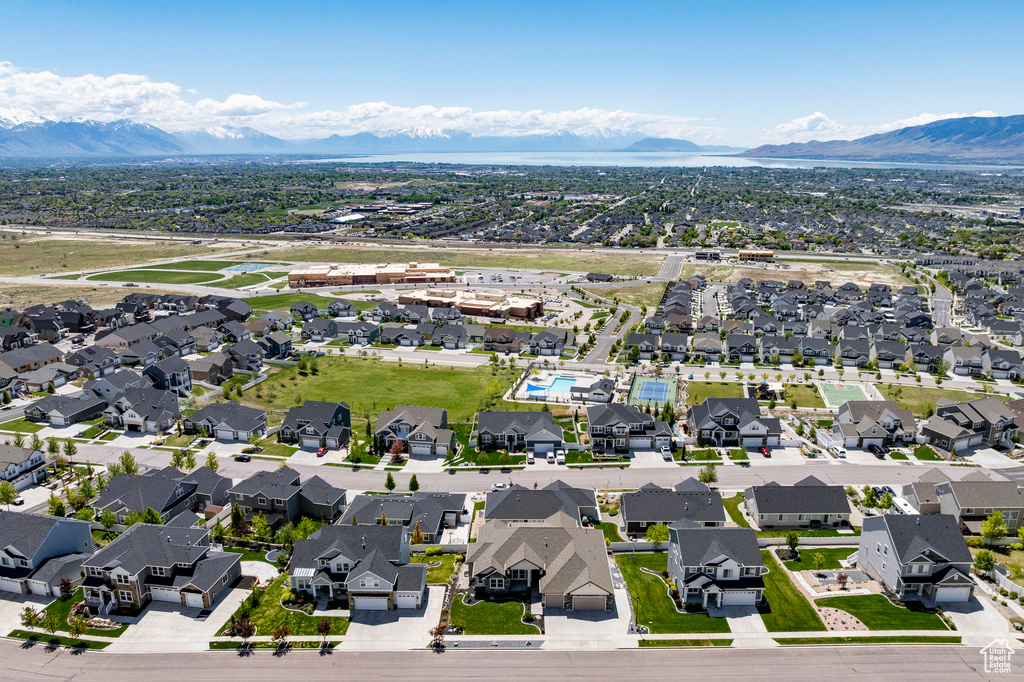 Aerial perspective of suburban area featuring a mountain backdrop