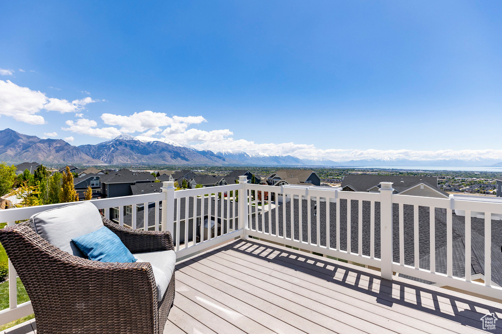 Wooden terrace featuring a mountain view and a residential view