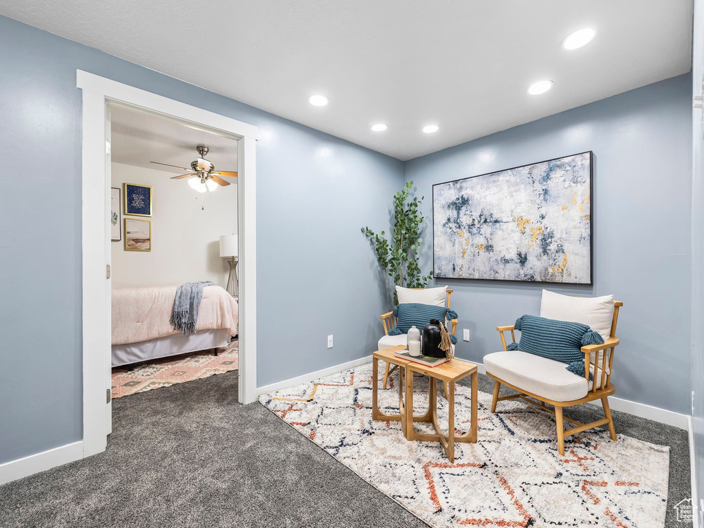 Living area featuring recessed lighting, carpet flooring, baseboards, and ceiling fan