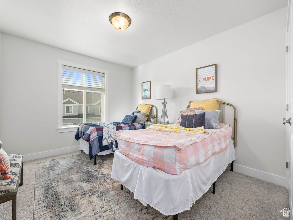 Carpeted bedroom with baseboards