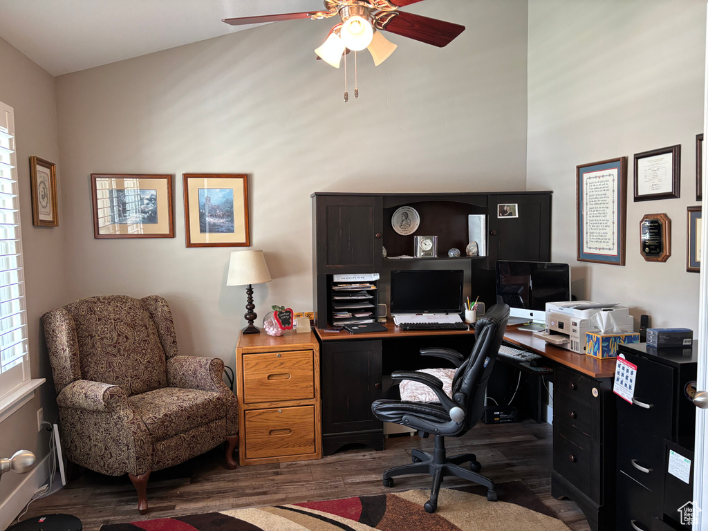 Home office with wood finished floors and a ceiling fan