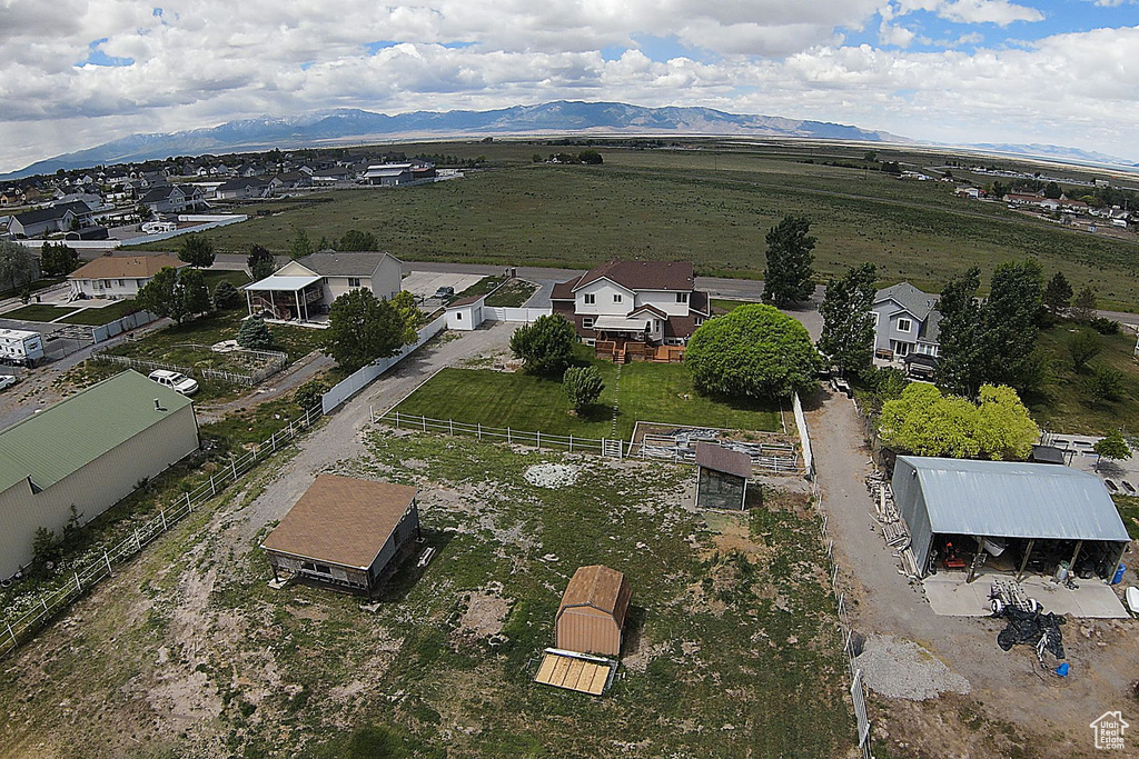Aerial perspective of suburban area with a mountain backdrop