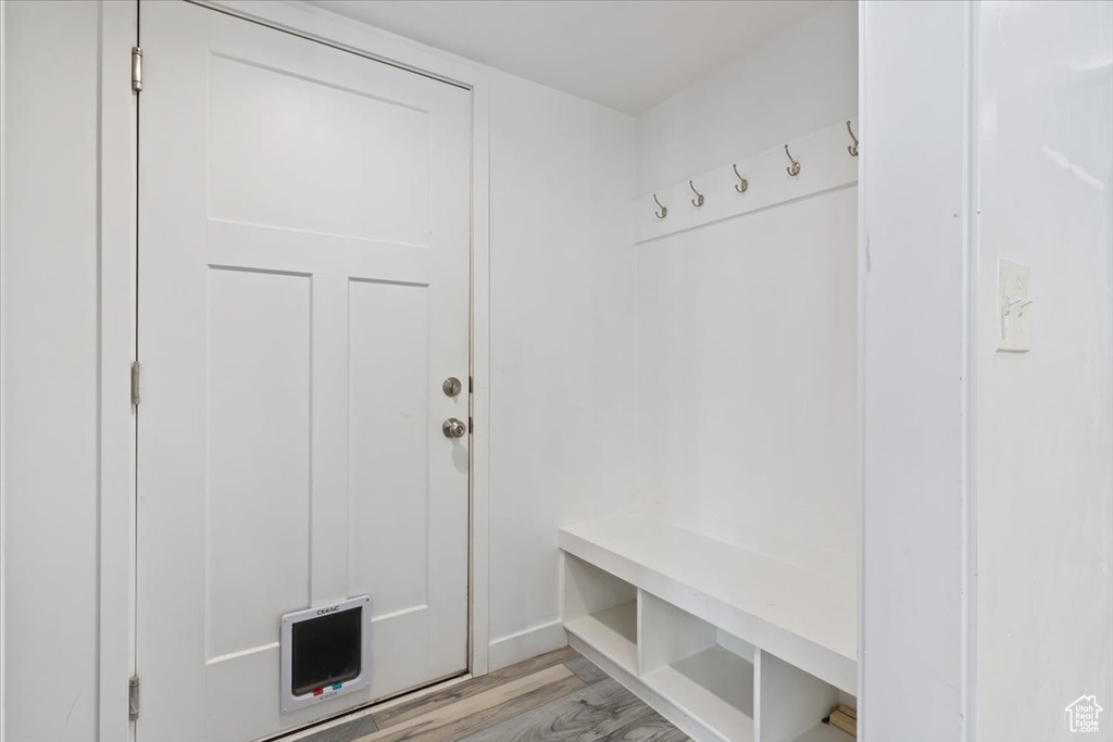Mudroom featuring light wood finished floors